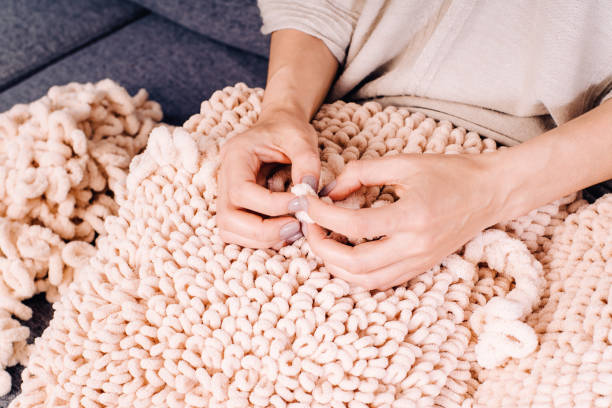 istock Knits made from thick soft yarn. Soft knitted cushions made of thick yarn. 1316466159