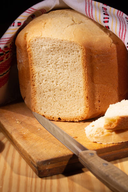 istock Fresh homemade bread on the kitchen table 1316468500