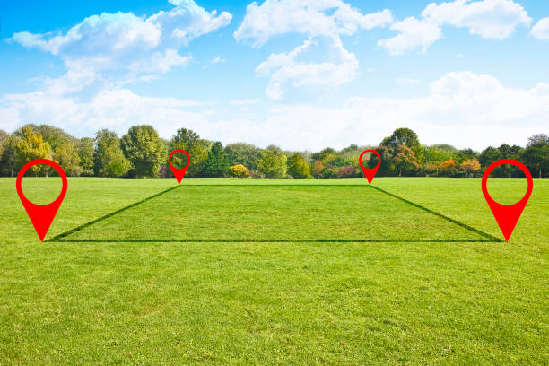 Land plot management - real estate concept with a vacant land on a green field available for building construction and housing subdivision in a residential area for sale, rent, buy or investment