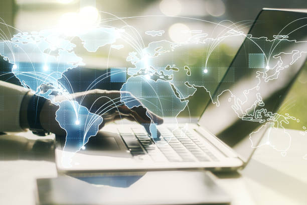 istock Abstract graphic digital world map with connections and hands typing on computer keyboard on background, globalization concept. Multiexposure 1316474450