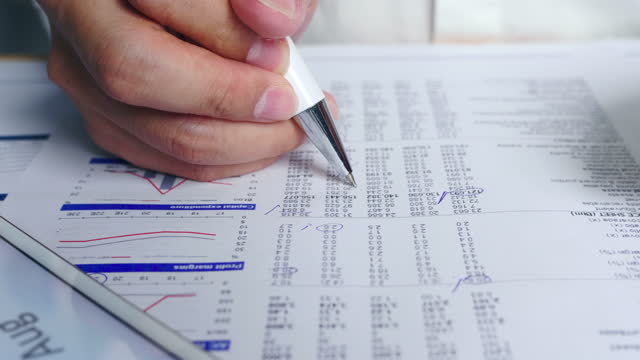 Analyzing business financial and marketing data on paper