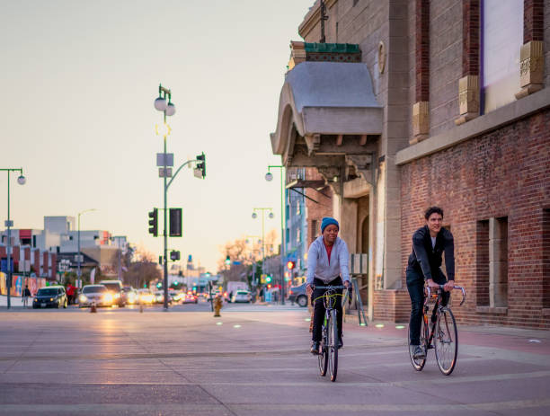 Two cyclists in the Historic Core district of Los Angeles, California.