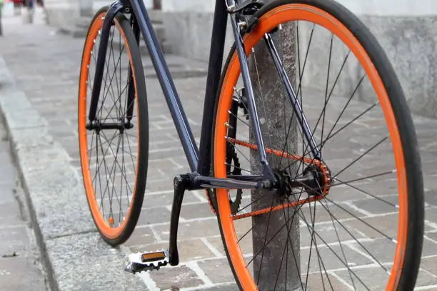 Photo of orange and black bicycle