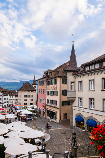 People visiting the market set up in the Hauptplatz in Rapperswil-Jona, a beautiful town in the Swiss canton of St. Gallen.