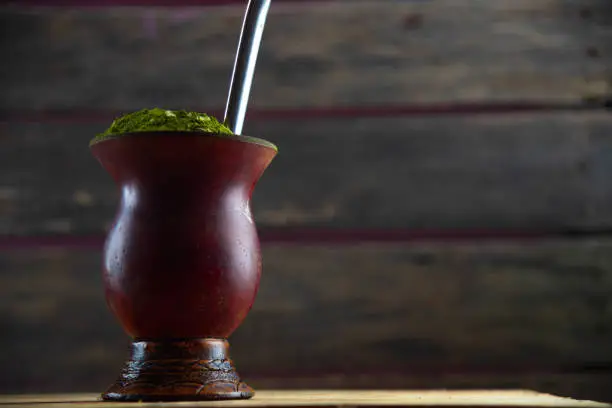 Photo of Poultry gourd or gourd with yerba mate (Ilex paraguariensis). Chimarrão is a South American drink left by indigenous cultures