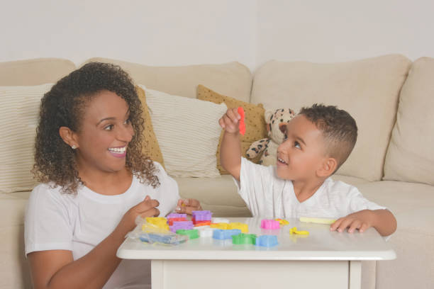 istock mom and son playing with clay 1316479574