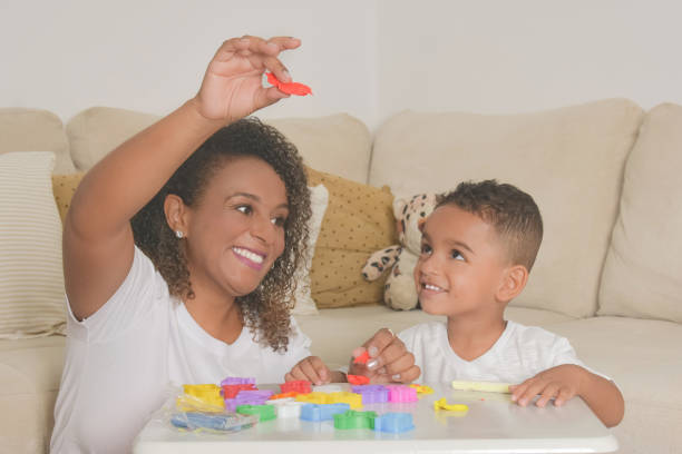 istock mom and son playing with clay 1316479656