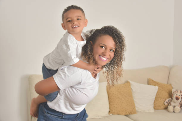 istock mother and son playing on bed 1316479684