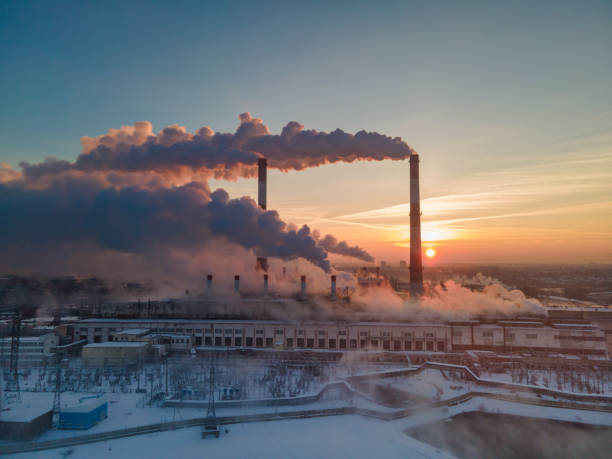 Plant pipes pollute atmosphere. Industrial factory air pollution Plant pipes pollute atmosphere. Industrial factory air pollution, smokestack exhaust gases. Industry zone, thick smoke plumes. Climate change, ecology and global warming climate justice photos stock pictures, royalty-free photos & images