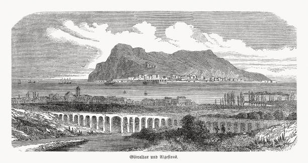 Historical view of Gibraltar and Algeciras, wood engraving, published 1868 Historical view of Gibraltar (UK) in the background and Algeciras (Spain) with the Aqueduct (built 1777 - 1783) in the foreground. Wood engraving, published in 1868. bay of water illustrations stock illustrations