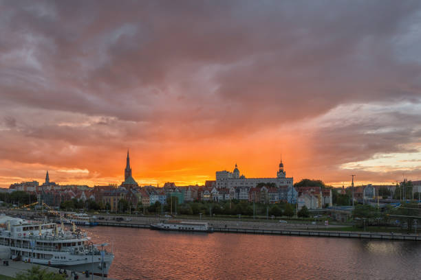 Szczecin, West Pomeranian Voivodeship, Poland - 06 September 2020: Sunset over Piastowski Boulevard with Ducal Castle and Archcathedral Basilica of St. James the Apostle-view from Labuda Bridge
