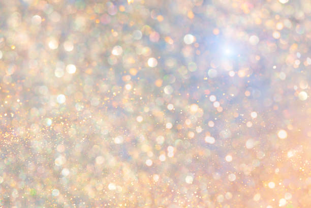istock Rainbow background with shiny gold sequins. Gold sparkles. Glittering gold, festive light background. 1316490179