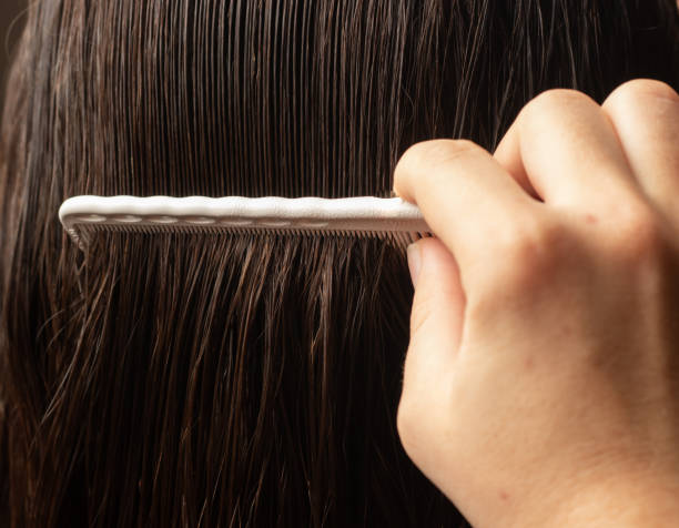 istock Back view of combing wet hair 1316490378