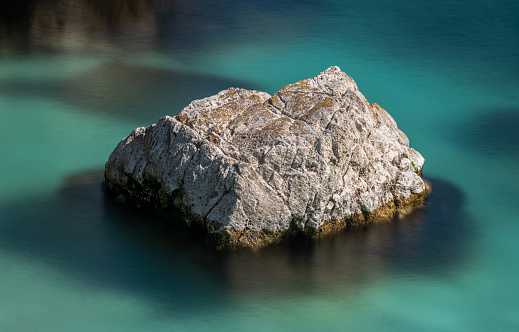 Sea and rocks sunny day long exposure landscape photography