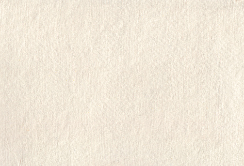 Handmade structured paper as background. A color between white and ecru.