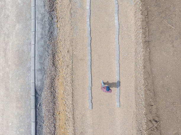istock Building new road. Worker inspecting how good work is done. 1316492797