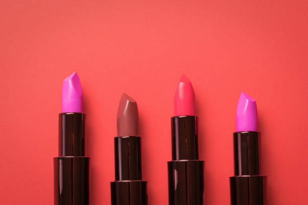 istock Four tubes of lipstick on a bright red background. 1316493857