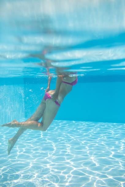 istock Young woman in a swimming pool 1316494617