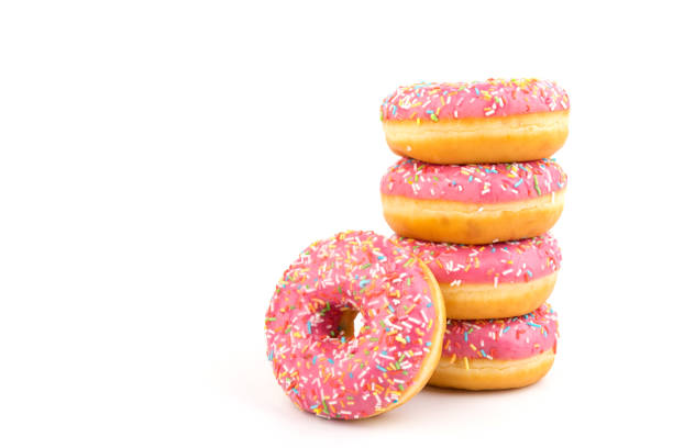 istock Fresh made Donuts isolated on white background. Doughnuts are traditional sweet pastries. Copy space for text. 1316494894