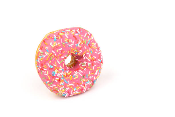 istock Fresh made Donuts isolated on white background. Doughnuts are traditional sweet pastries. Copy space for text. 1316495083