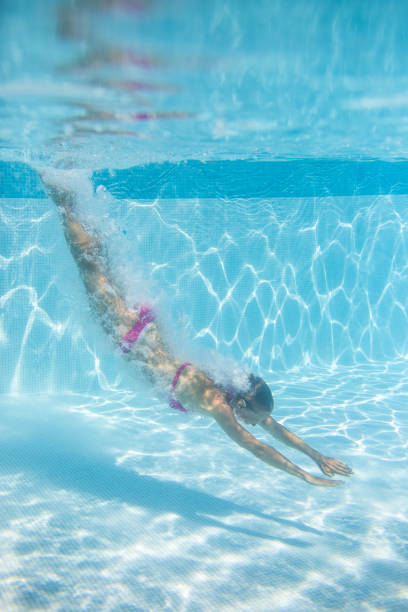 istock Young woman in a swimming pool 1316495319