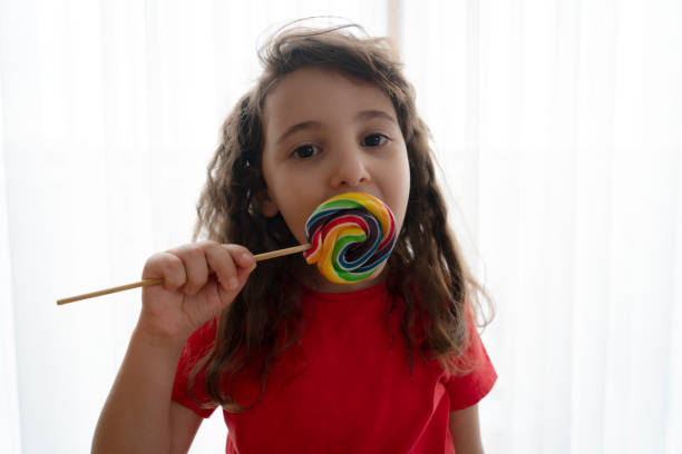 istock Little girl with candy 1316496044