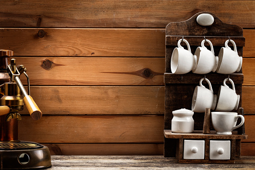 Coffee cups on wooden background
