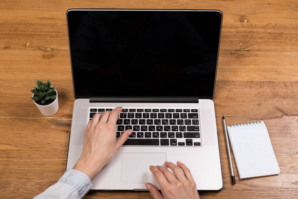istock Hands close-up. Working on a computer, laptop. Office background. Online work. Typing 1316496188