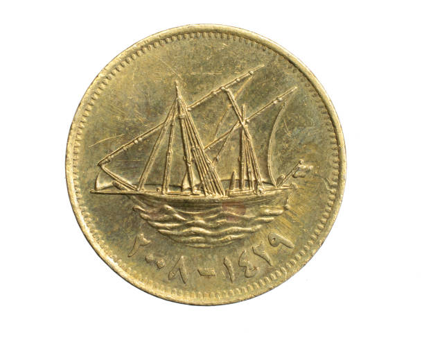 istock Kuwait five filis coin on a white isolated background 1316496527