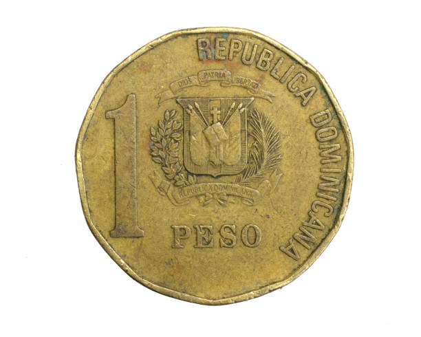 istock Dominicana one peso coin on a white isolated background 1316496546