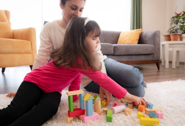 istock Mother and Daughter playing together 1316498012
