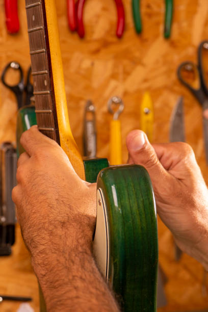 istock luthier working on repairing a guitar 1316500477