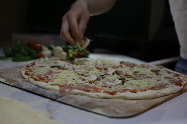 istock A chef preparing  pizza. Stock photo 1316506164