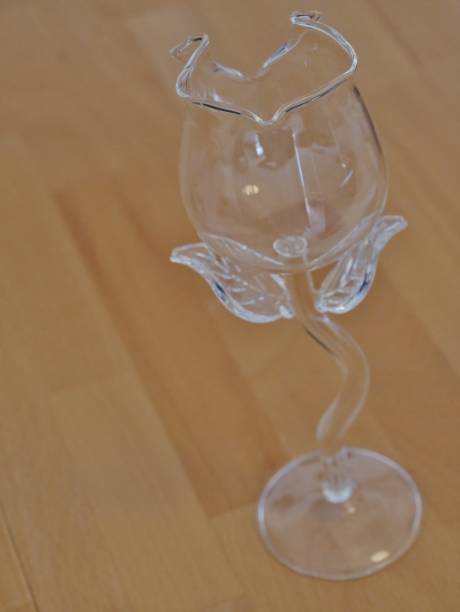 istock Ornate wine glass staples on wooden table 1316507217