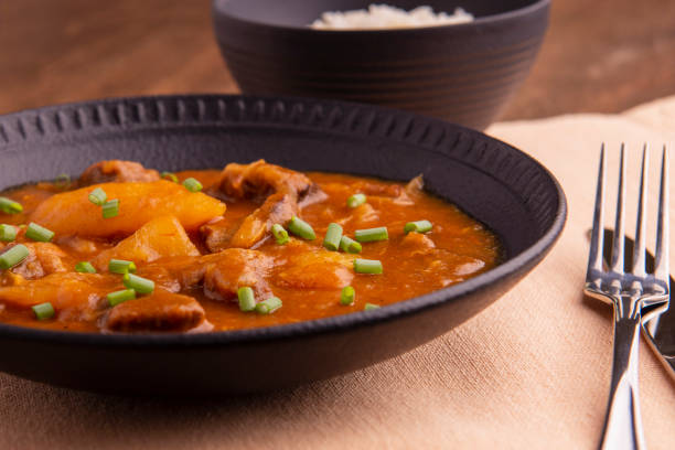 istock plate with cooked cassava and meat on wooden table 1316507474