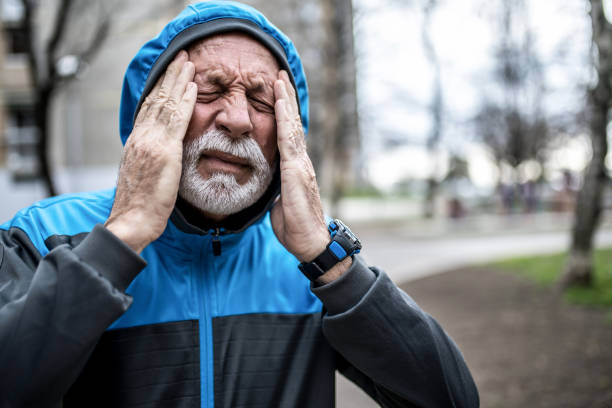 istock Sporty senior man having a strong headache. 1316507768