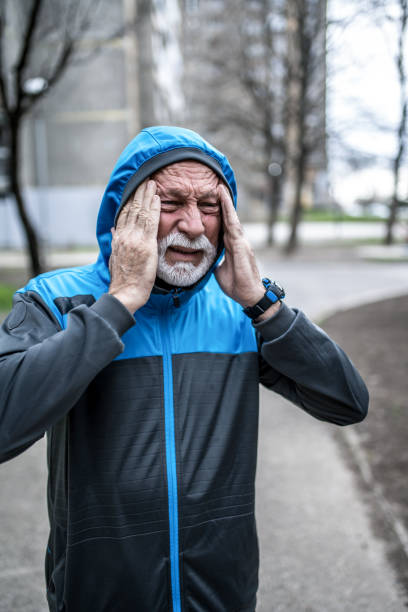 istock Sporty senior man having a strong headache. 1316508288