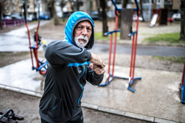 istock Senior male fighter practicing elbow punches outdoors. 1316510957