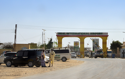 Hargeisa, Somaliland, Somalia: Hargeisa Egal International Airport entrance gate, improvised car park where people wait outside the main checkpoint on the external perimeter.