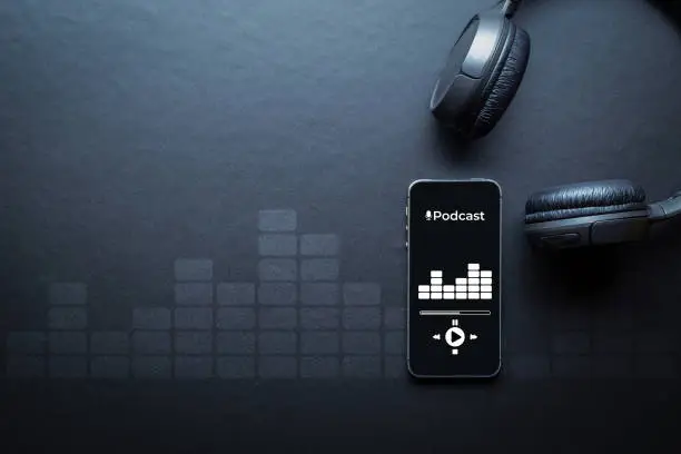 Podcast audio equipment. Audio microphone, sound headphones, podcast application on mobile smartphone screen. Recording sound voice on dark background. Live online radio player mockup banner