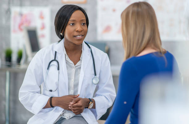 istock Doctor consulting female patient 1316513370