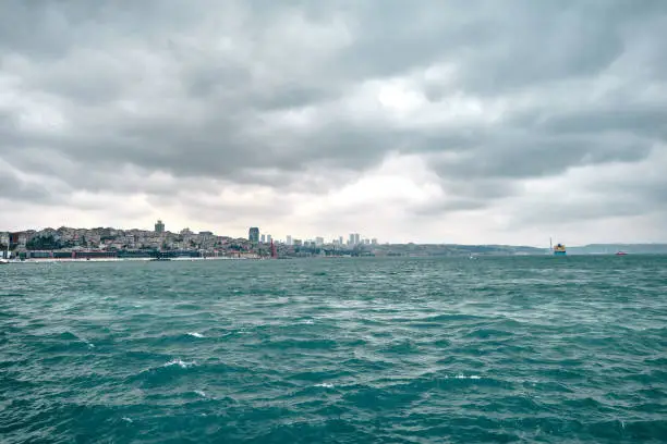 Photo of photo taken by galata bridge in karakoy shore during overcast weather in golden horn istanbul.