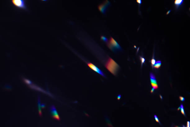 istock colorful warm rainbow crystal light leaks on black background 1316517428