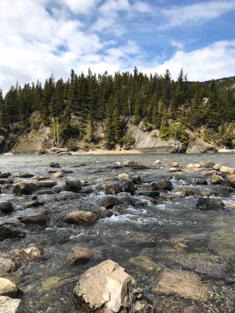 istock Mountain with clear sky and water running through rocks 1316517522
