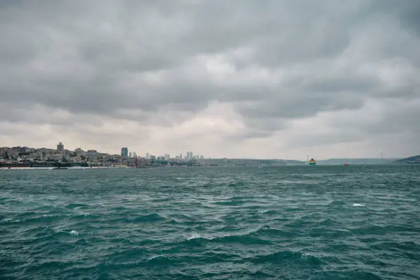 Photo of photo taken by galata bridge in karakoy shore during overcast weather in golden horn istanbul.