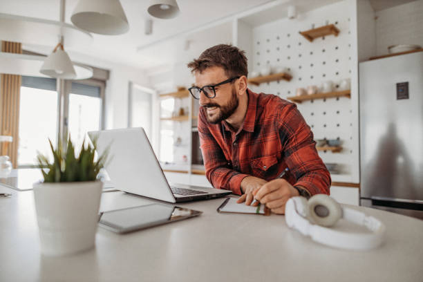 Young man working from home stock photo