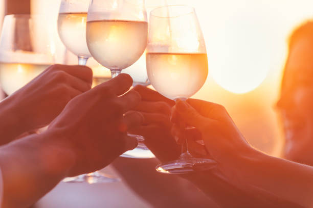 istock Group of friends having fun and toasting outdoors with white wine 1316520942