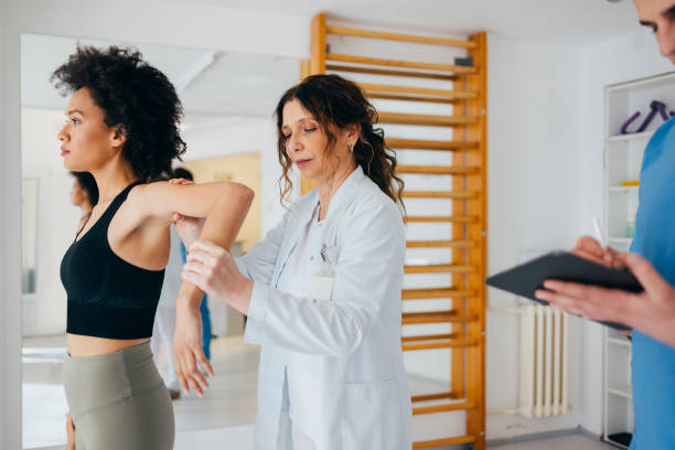 istock Female Doctor is Checking the Young Woman's Elbow 1316521098