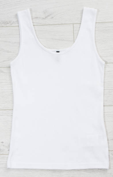 White tank top back view tshirt template mock up on white wooden background top view.