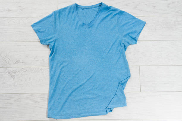 istock Blue t-shirt mock up top view, blue shirt copy space 1316523755
